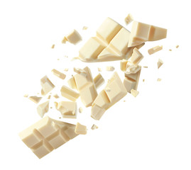 Chocolate explosion, pieces shattering on white background
