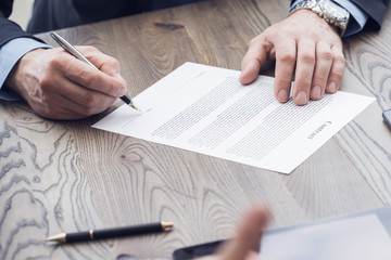 Businessman signing a contract