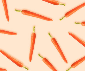 Whole carrots on beige background. Pattern design