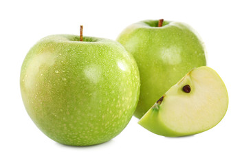 Cut and whole green apples on white background