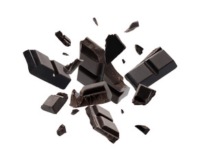 Dark chocolate explosion, pieces shattering on white background