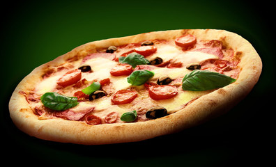 Hot tasty pizza Diablo on dark background. Image for menu or poster