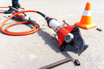 Hydraulic shears. Tool for cutting metal in emergency situations. The process of learning rescuers. Demonstration of rescue equipment.