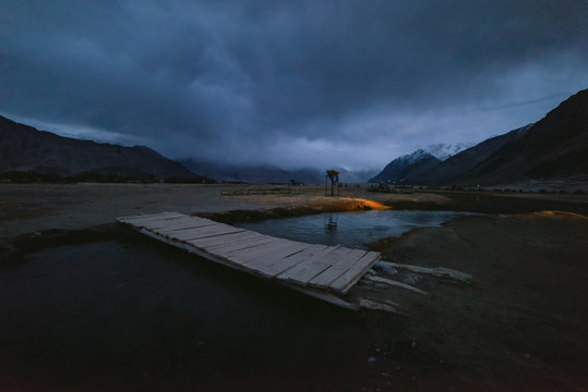 Bridge and snow peaks view in india himalaya