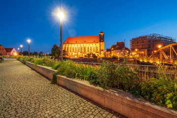 Fototapeta premium Wroclaw, Poland August 5, 2020; Cityscape of Wrocław at dusk on the Odra River.