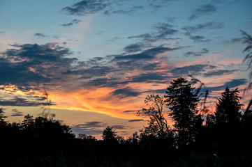 dramatic sunset with clouds over lake