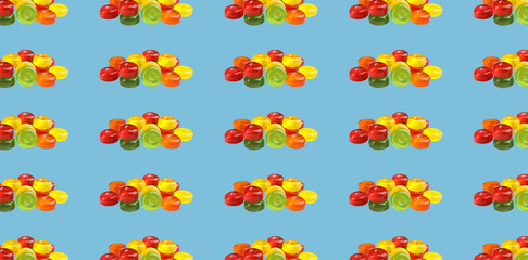 Fototapeta na wymiar Collage with tasty candies on light blue background, pattern design