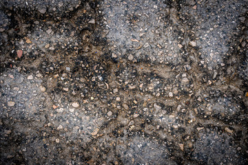 Old asphalt road cracked texture