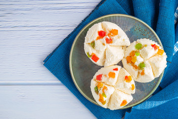 Top view of  Thai steamed cupcakes topped with dry fruit on plate