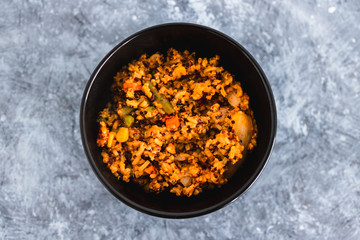 plant-based food, vegan rice and quinoa with mixed vegetables