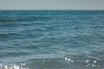 Close-up of sand on the beach and water of the Yarovoe salt lake (Altai Territory).