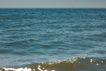 Close-up of sand on the beach and water of the Yarovoe salt lake (Altai Territory).