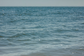 Close-up of sand on the beach and water of the Yarovoe salt lake (Altai Territory).