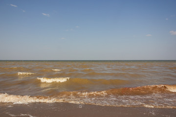 Close-up of sand on the beach and water of the Yarovoe salt lake (Altai Territory).