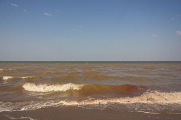 Close-up of sand on the beach and water of the Yarovoe salt lake (Altai Territory).