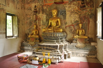Buddha statues in a colorful temple