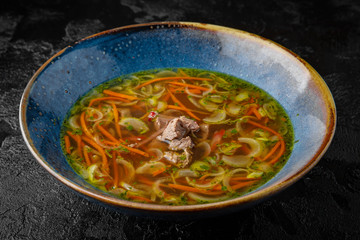 Beef broth with vegetables. Balanced tasty diet food. First course