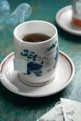 Hot tea on an old chinese tea cup
