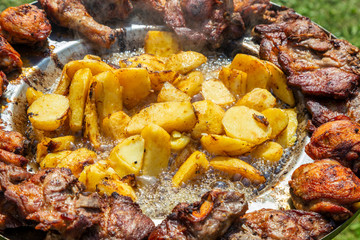 Chunks of potatoes frying in hot oil