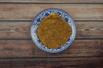 omelet on the wooden background