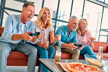 Senior friends having fun at home