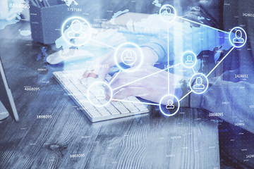 Social network theme hologram with businessman working on computer on background. Concept of world wide web. Multi exposure.