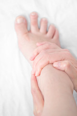 Obraz na płótnie Canvas Bare feet feel pain with foot massage