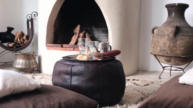 Birds eating breakfast in luxury bedroom with arabic decoration and fireplace
