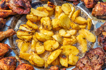 Potatoes cut into pieces frying