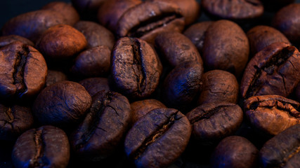 Coffee beans and ground coffee in a macro shot, close-up
