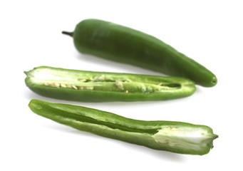 Green Chili Pepper, capsicum annuum against White Background