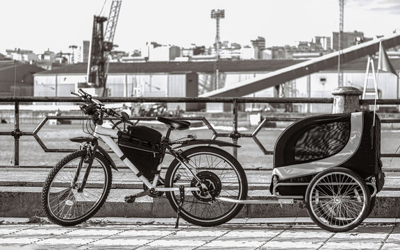 Isolated Child Bicycle Trailer parked in a pier