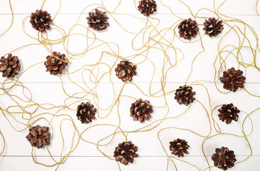 Naklejka premium Christmas card with pine cones on the table. Merry Christmas and Happy New Year !! View from above.