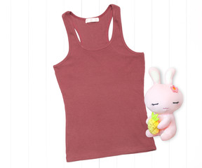 Coral color tank top with soft toy on white background