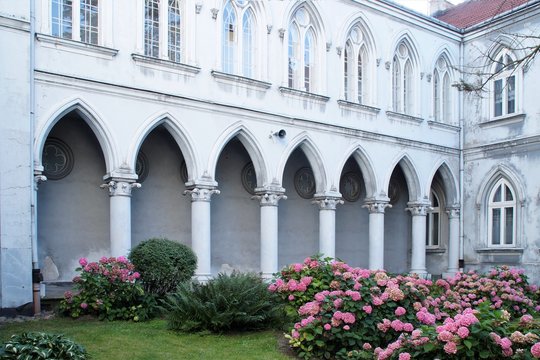Garden and building fragment of the old neo-gothic Mariavite monastery in Plock, Poland