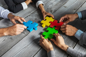 Business people and puzzle pieces
