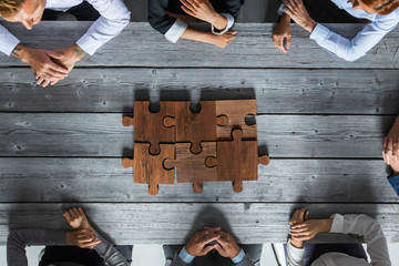 Business people and puzzle pieces