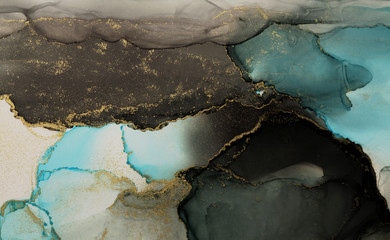 Abstract black, blue and gold glitter color background. Marble texture. Alcohol ink colors.