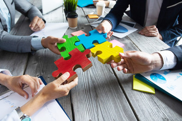 Business people and puzzle pieces