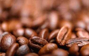 Close up macro a group roasted brown or black coffee grains background. Close up coffee beans.