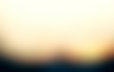 Naklejka premium Sun dawn sky light yellow blur empty background. Dark ground bottom. Defocus exterior simple pattern.