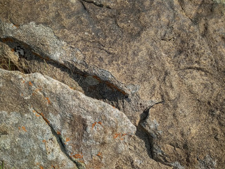The surface texture of a huge stone with irregularities