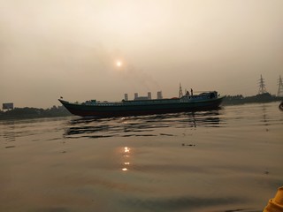 fishing boats at sunset