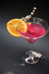 Pink coctail  with orange slice. Summer drinks. 