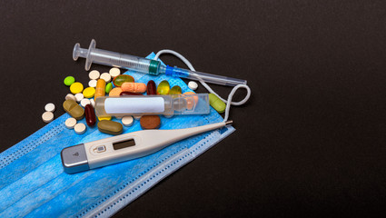 Novel coronavirus 2019-nCoV, WUHAN virus concept. Surgical or protective mask with medicaments. Chinese covid-19 coronavirus outbreak.