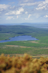 Scenic view of beautiful landscape with forest, hills and sky clouds