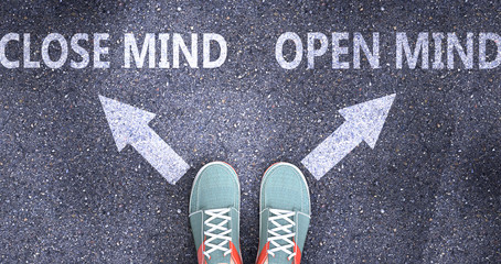 Close mind and open mind as different choices in life - pictured as words Close mind, open mind on a road to symbolize making decision and picking either one as an option, 3d illustration