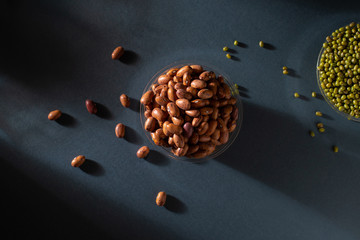 Pinto beans in glass pot with mung bean image top view, photography, light and shade