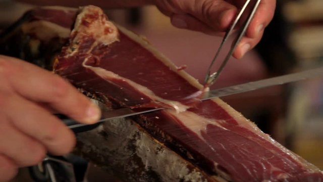Cutting jabugo ham.