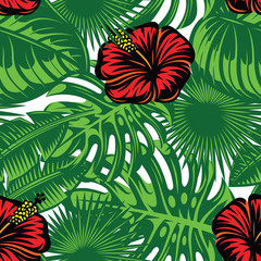 Seamless pattern with colored tropical leaves and hibiscus flowers. Vector illustration